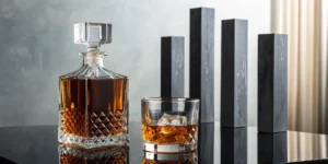 The difference between proof and ABV explained with a crystal whiskey decanter and glass.